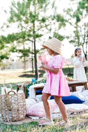 playful in pink dress